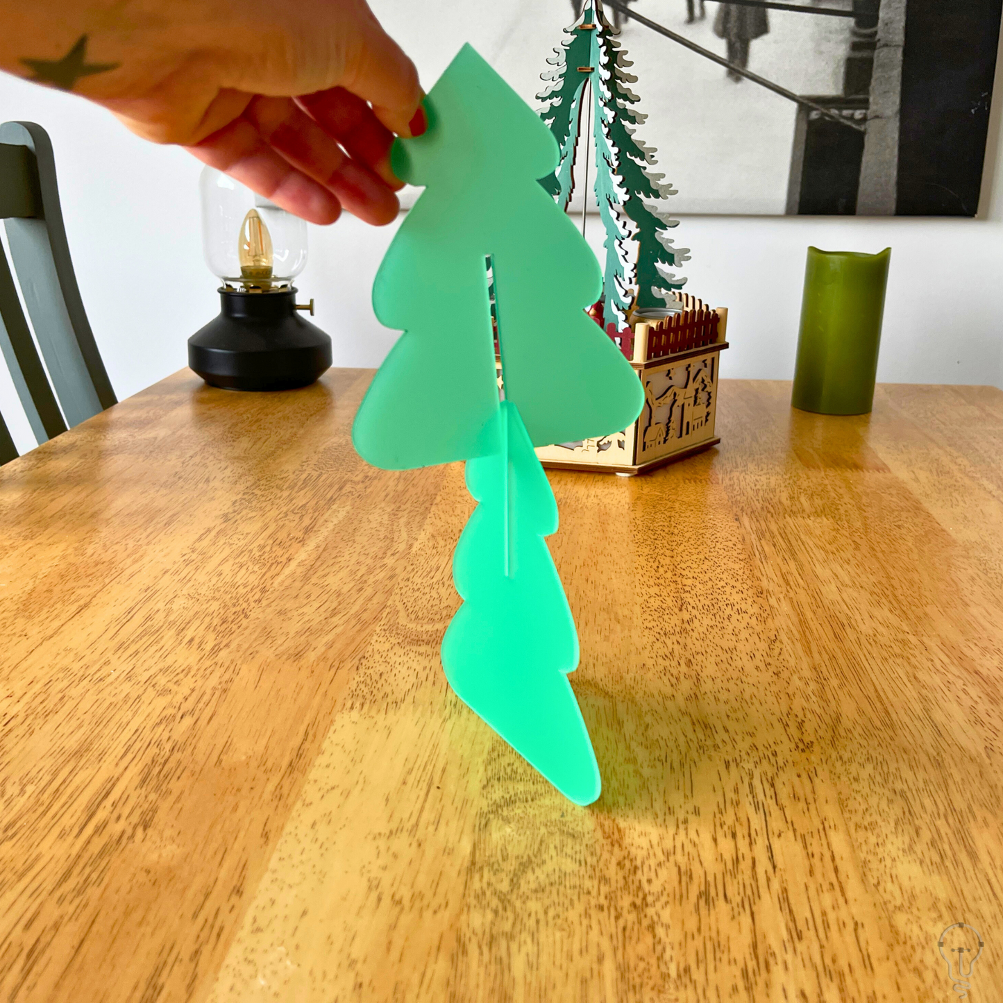 A beautifully designed laser-cut Christmas tree decoration, perfect for adding festive charm to your table, window sill, or mantel.